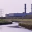A gas plant with a river in the foreground