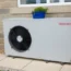An air source heat pump outside a house.