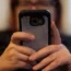 File photo dated 08/05/19 of a woman using her mobile phone.