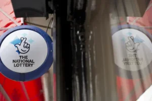 National Lottery firm sees UK sales and earnings slip