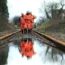 Network Rail employees walk up a flooded line