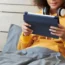 A teenager using a tablet