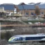 Train passing a housebuilding site