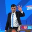 Rishi Sunak smiles and waves