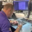 A technician working at Currys' Repair Centre in Newark, Nottinghamshire