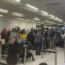 Passengers queuing at Gatwick Airport