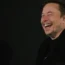 Elon Musk laughs