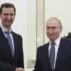 Bashar Assad shakes hands with Vladimir Putin