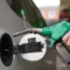 A man filling up a car with fuel