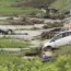 A police vehicle is seen overturned