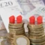 Models of homes on coins and banknotes