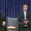 Iranian Supreme Leader Ayatollah Ali Khamenei gives his official seal of approval to newly elected President Masoud Pezeshkian at a ceremony in Tehran