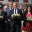 Prime Minister Keir Starmer is seen carrying a floral tribute (centre) near the scene in Hart Street, Southport