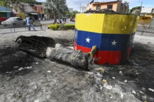 Hugo Chavez statues toppled across Venezuela in post-election unrest
