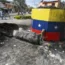 A destroyed statue of the late Venezuelan president Hugo Chavez lies next to its base in Valencia, Venezuela