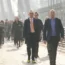 Commuters walking across a bridge in central London