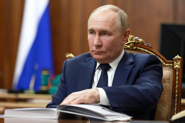 e8bb99a6cca044a5a7773dae1a4f3f50 Russian President Vladimir Putin listens to Rostec State Corporation CEO Sergei Chemezov during their meeting at the Kremlin in Moscow