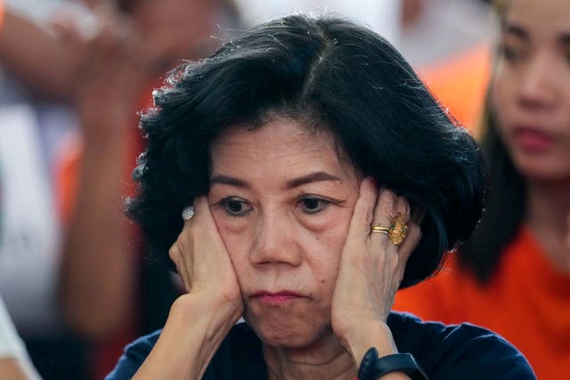 00341182e9ea4a26ba276e9778ca1bc3 A supporter of the Move Forward Party reacts at the party headquarters