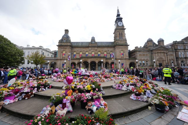 2-77192938 Flowers outside the Atkinson Art Centre following the July 29 knife attack (Owen Humphreys/PA)