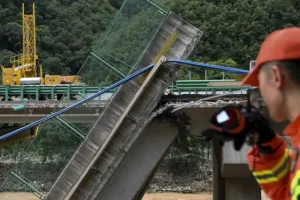 Death toll from China bridge collapse raised to 38 as two dozen still missing