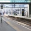 A man pushing his bicycle on an empty platform at Kings Cross