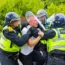 Man is detained following clash as hundreds of police and protestors clash outside a Holiday Inn Express on Manvers way, Rotherham.