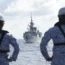 Philippine Navy personnel watch the Canadian vessel HMCS Montreal (FFH336) during the Multilateral Maritime Cooperative Activity being held in the West Philippine Sea,