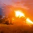 A Russian Army multiple rocket launcher fires towards a Ukrainian position at an undisclosed location