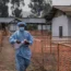 A health worker walks past a mpox treatment centre in Munigi, eastern Congo