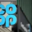 A Co-op store sign on the side of a building