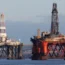 An oil platform standing amongst other rigs that have been left in the Cromarty Firth near Invergordon in Scotland