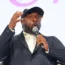 American singer Will.i.am giving a speech.