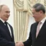 Russian President Vladimir Putin and Chinese Premier Li Qiang shake hands