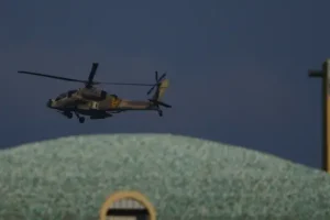 Israel aims strikes at Lebanon as Hezbollah launches attack over commander death