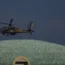 An Israeli Apache helicopter flies over Israel