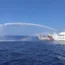 A Chinese Coast Guard ship (right) uses its water cannons on a Philippine Bureau of Fisheries and Aquatic Resources (BFAR) vessel