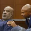 Duane Davis listens to his lawyer