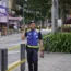 Police stand guard on a closed roadside after another deep sinkhole appeared a week after a woman fell into a sinkhole when a sidewalk caved in in Kuala Lumpur