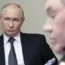 Russian President Vladimir Putin, left, leads a meeting with top security and defence officials at the Novo-Ogaryovo state residence outside of Moscow, Russia