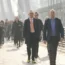 Commuters in suits and ties cross the Golden Jubilee Bridges between Charing Cross and the South Bank in London