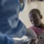 A doctor checking a boy with mpox