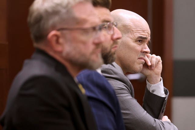 9e35bb959121454f935dab4a081d41da Robert Telles, right, listens to closing arguments during his murder trial