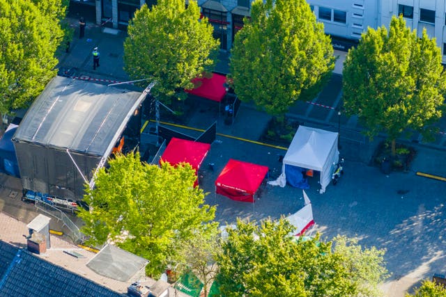 ba8f3e0216dd477e8f5b3cc89522f051-1 Red tents in a town square