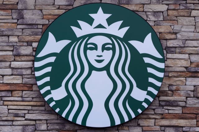 ce1d9fd11ff5439d985d7bccd7e6fe44 A Starbucks mermaid logo sign is displayed on a store in the US