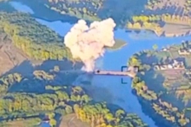 d4d13c2989e94edaa43256e2e53ee78f Smoke billows in what is said to show the destruction of a key bridge in Russia’s Kursk region